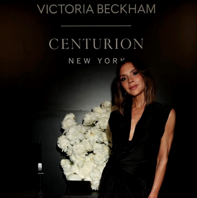 Victoria Beckham at the Centurion New York launch beside a white floral wall